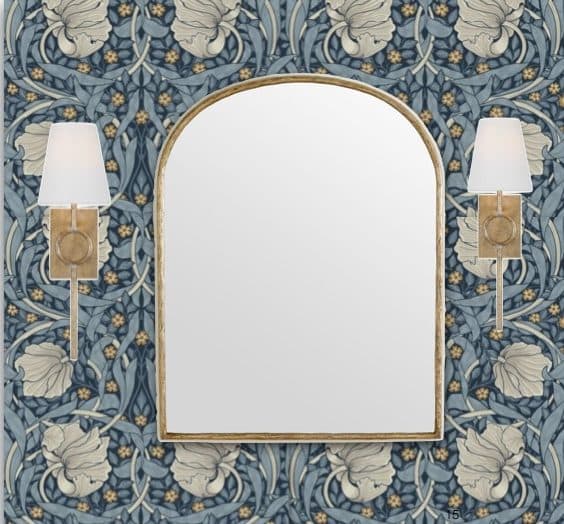 Powder room mirror and sconce detail with blue botanical wallcovering.