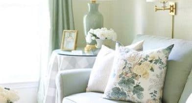 Newtown bedroom detail with patterned pillows on pale bedding.